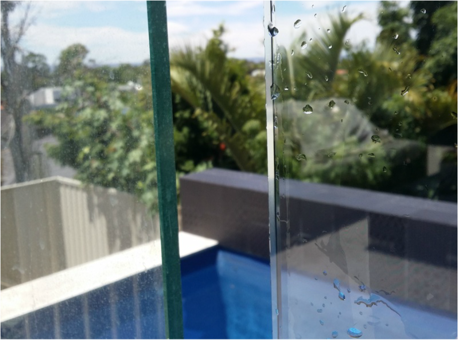 Spot The Difference 9 Pool Balustrading, one panel cleaned with Pure Water.